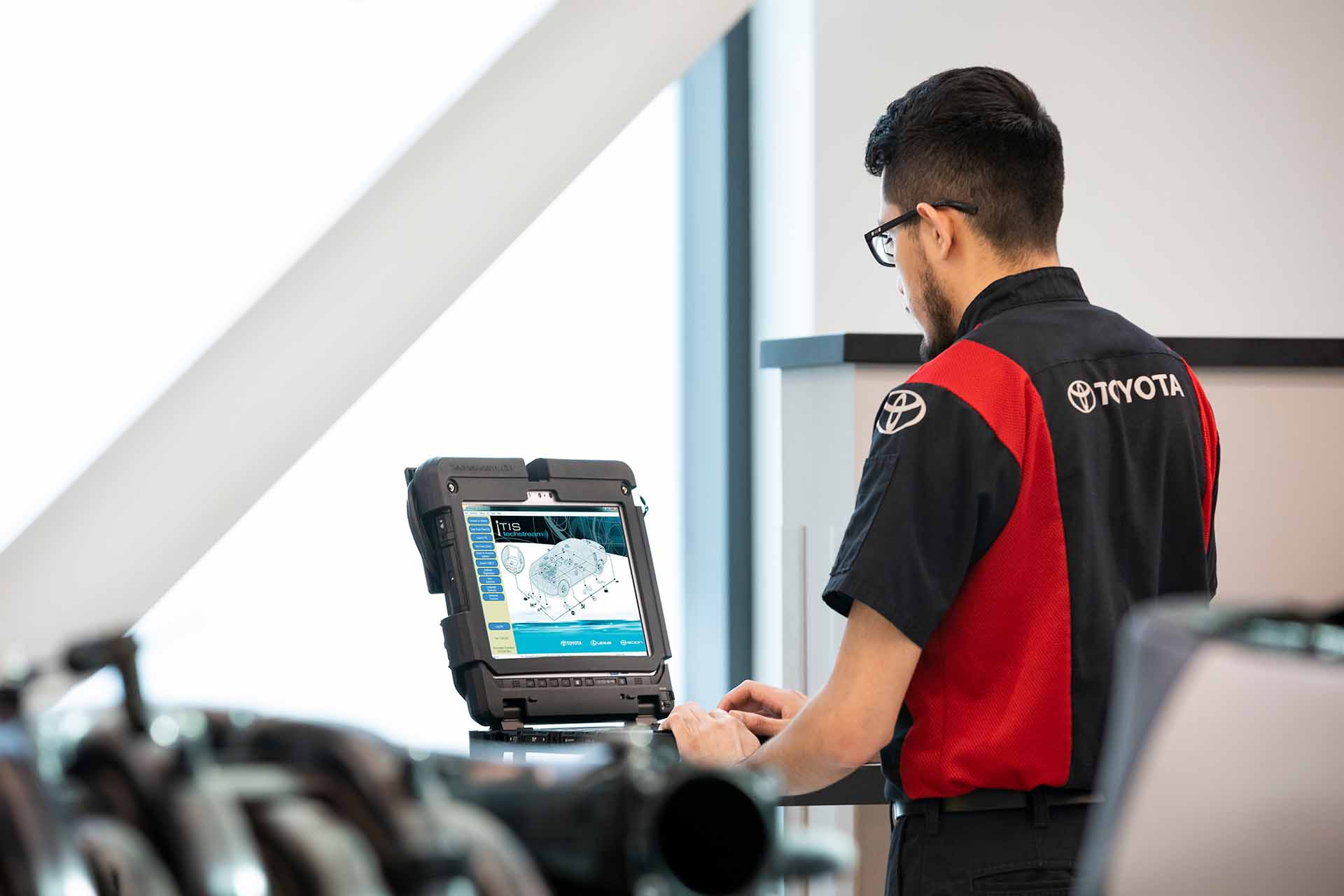 Village Toyota technician working in the service bay