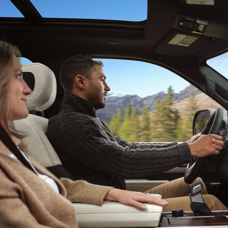 Adventurous Couple Riding Inside Toyota Sequoia